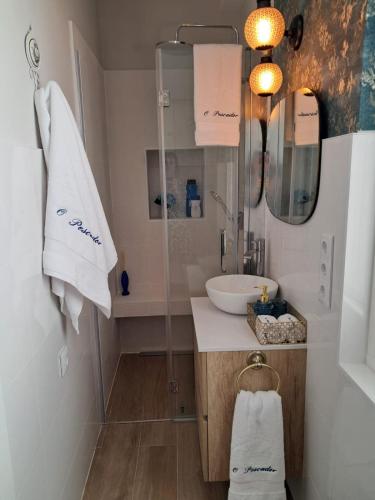 a bathroom with a sink and a shower at O Pescador in Noya