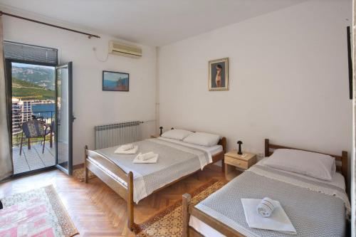 Ένα ή περισσότερα κρεβάτια σε δωμάτιο στο Madra Rooms and Apartments