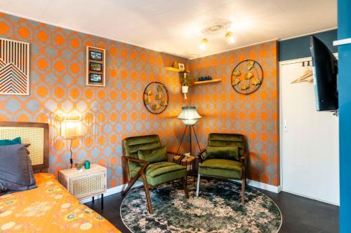 Posezení v ubytování B&B de Gouwe Tijd, suite "Gouden Ginkgo"