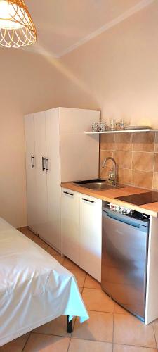 a kitchen with a sink and a counter top at Beach Studio apartment 3, Komi in Chios