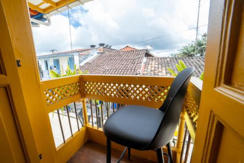 a room with a chair on a balcony at Casa Serafin Hotel in Salento