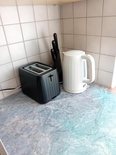 a trash can sitting on the floor in a kitchen at 53 sqm for 4 people 
