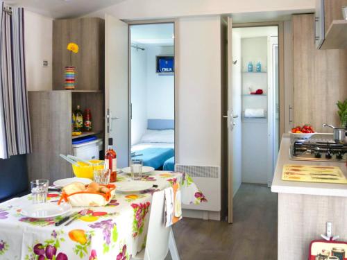 a kitchen with a table with a plate of food on it at Holiday Home Il Pioppeto by Interhome in Vasto