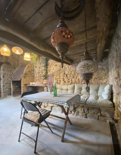 a living room with a table and a couch at Casa Rural Casa Selmo in Carreno