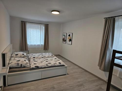 a bedroom with a bed and a window at Modern 83 sqm apartment with large terrace 
