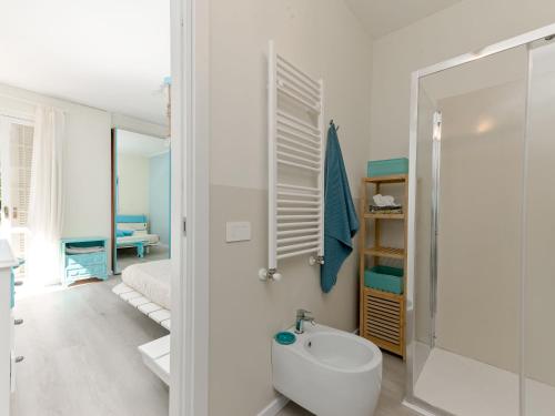 a bathroom with a shower and a toilet and a sink at Villa Tiffany by Interhome in Punta Ala