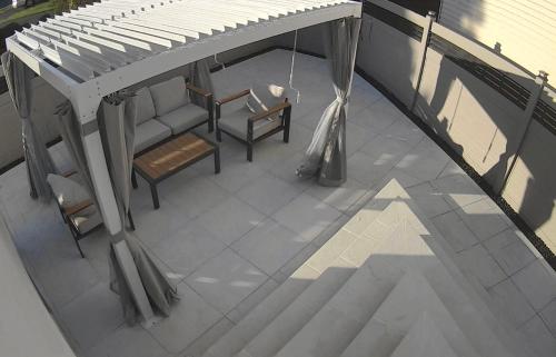 an overhead view of a porch with a piano and chairs at Aum Quite Heaven Stay in Monroe Township
