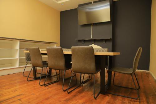a conference room with a table and chairs at The Mandy Guesthouse in Kokstad