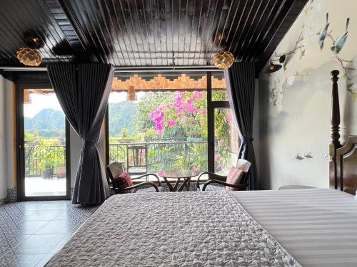 a bedroom with a bed and a large window at Amazing View Homestay in Ninh Binh