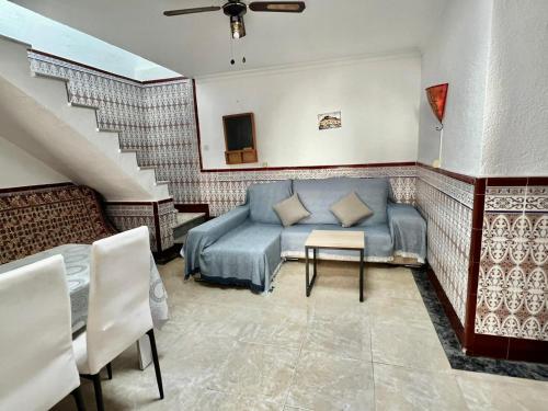 a living room with a couch and a table at Casa Andaluza in Carboneras