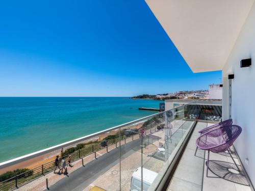 a balcony with a view of the ocean at Holiday Home NANOUSH by Interhome in Albufeira
