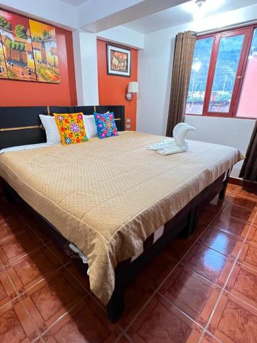 Ένα ή περισσότερα κρεβάτια σε δωμάτιο στο Hostal Pacha Inn