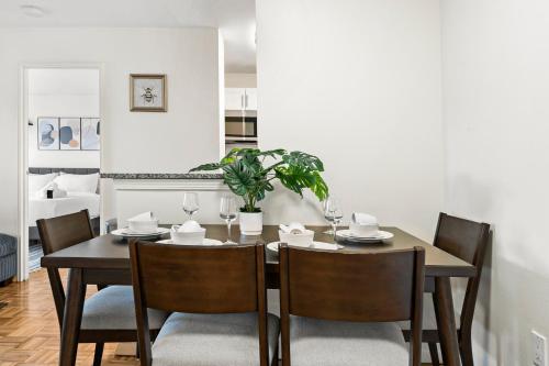 a dining room with a table and chairs at Furnished Apartment in Brookline