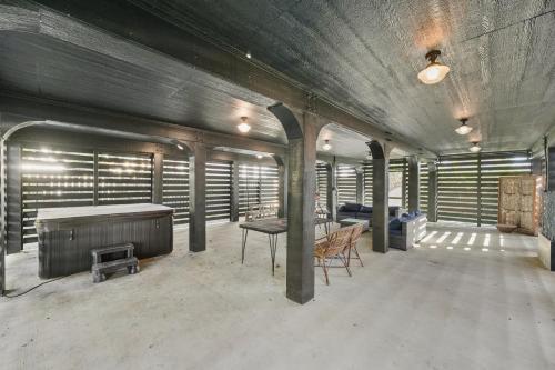 an empty room with a table and chairs in a building at Ebb and Glow Retreat in Galveston