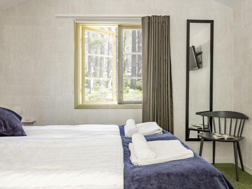Ένα ή περισσότερα κρεβάτια σε δωμάτιο στο Holiday Home Hölick Minichalet Plus 6 by Interhome