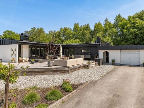 a modern house with a driveway at Apartment Björkliden by Interhome in Mörrum