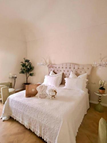 a bedroom with a white bed with white pillows at La Presentosa b&b in Fossacesia