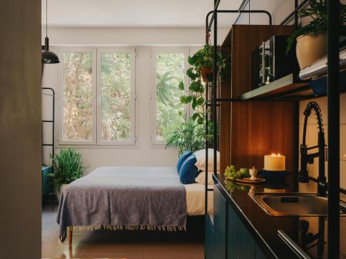 a bedroom with a bed and two windows at Brassbell l DT l Hannaux l Tahrir sq in Cairo