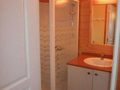a bathroom with a sink and a shower at Chalet Edelweiss au cœur de la nature vosgienne - FR-1-583-441 in Mélisey