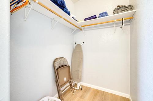 a walk in closet with a chair and shelves at 6 Mi to Downtown Pahrump Scenic Desert Retreat in Pahrump