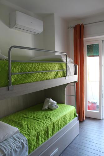 Postel nebo postele na pokoji v ubytování Borgo Marinaro Cetraro, Calabria