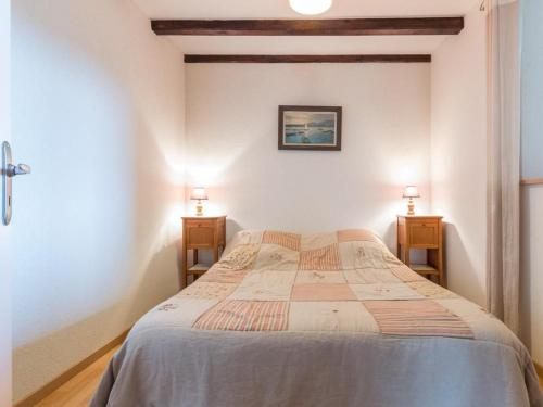 a bedroom with a bed and two night stands at Ancienne ferme rénovée dans les Vosges - FR-1-583-487 in La Longine