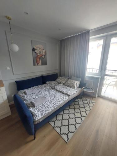 Postel nebo postele na pokoji v ubytování Apartament Margot - Centrum