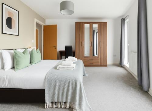 a bedroom with a bed with a blanket on it at Premium 2 Bed Flat near Colindale Station in Colindale