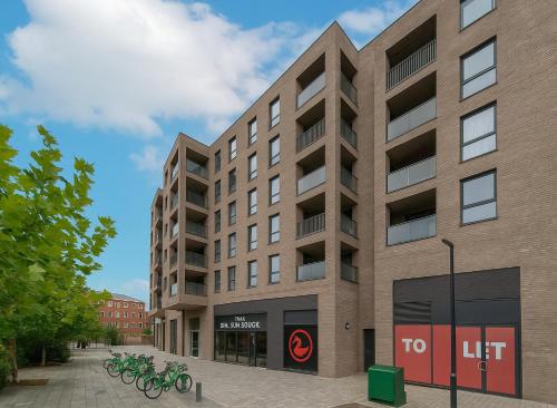 a building with bikes parked outside of it at Premium 2 Bed Flat near Colindale Station in Colindale