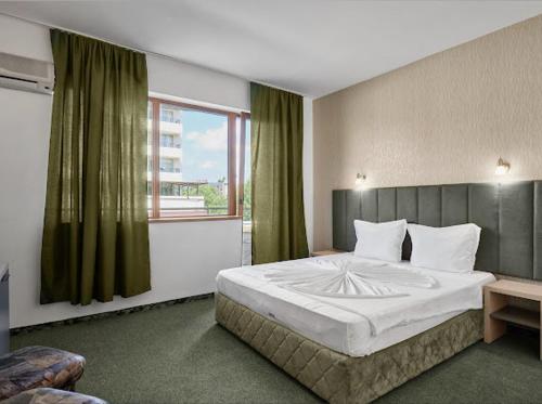 Postel nebo postele na pokoji v ubytování Hotel Opal