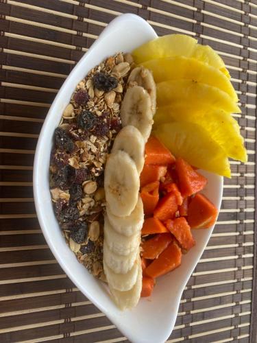 a bowl of food with nuts and fruits and vegetables at AFRA Reserva Natural in Santa Marta