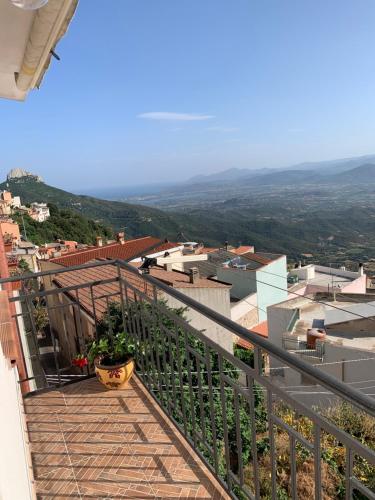 a balcony with a view of a city at Dommu Montes e Mare in Baunei