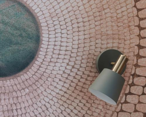 a roll of toilet paper on the floor of a bathroom at Al Borgo 01 Luxury Suites in Sardinia in Abbasanta