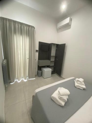 Ένα ή περισσότερα κρεβάτια σε δωμάτιο στο NOGA rooms