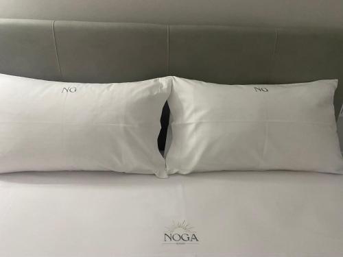 Ένα ή περισσότερα κρεβάτια σε δωμάτιο στο NOGA rooms