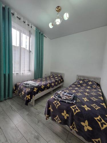 Postel nebo postele na pokoji v ubytování Гостей дом Чоң Сары Ой