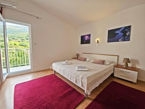 Ένα ή περισσότερα κρεβάτια σε δωμάτιο στο AB Villa Podstrana