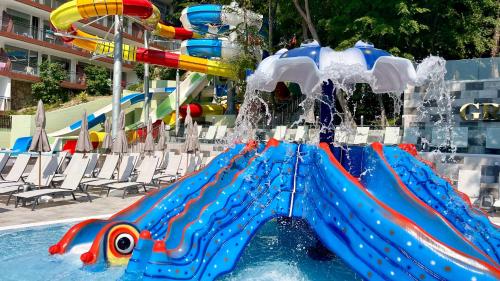 a water slide in a pool at a resort at BSA Gradina Hotel & Aquapark - All Inclusive in Golden Sands