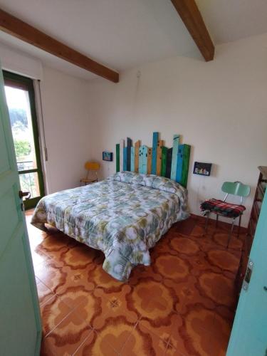 a bedroom with a bed with books on the wall at Casa Sole Luna in Torre del Greco