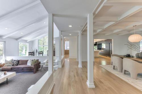 a living room with a couch and a table at Luxury Hideaway nearly 9000 Sq Ft with Elevator and Huge Deck in Brentwood