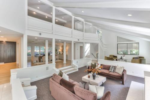 a living room with a couch and a table at Luxury Hideaway nearly 9000 Sq Ft with Elevator and Huge Deck in Brentwood