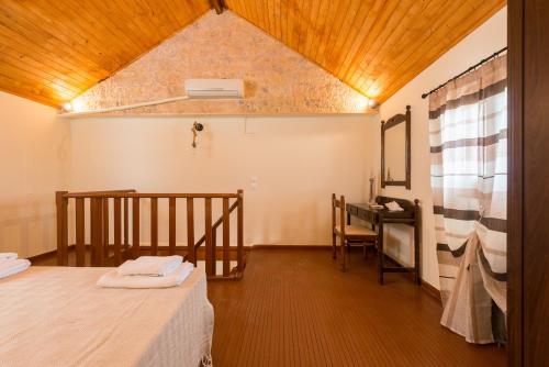 a room with a bed and a desk in it at The old town Neighbourhood in Rhodes Town
