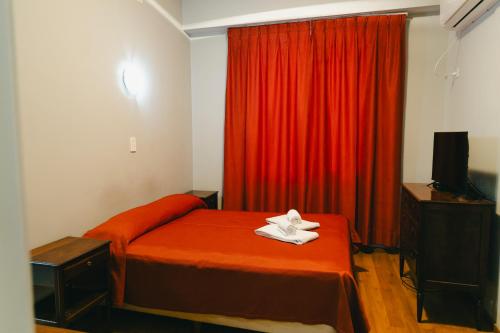 Postel nebo postele na pokoji v ubytování Constitución Palace Hotel