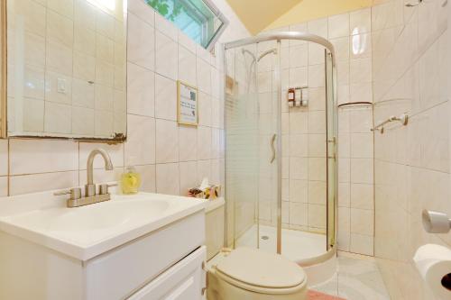 a bathroom with a sink toilet and a shower at Screened Porch and Fire Pit Cabin Near Bethel Woods in Mongaup Valley
