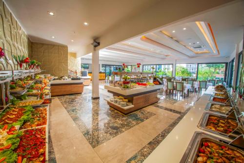 a buffet area of a hotel with a lot of food at Class Unique Beach in Marmaris
