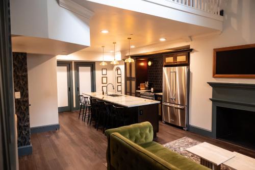 a kitchen with a couch and a kitchen island at The Gas Lamp Hotel in Philadelphia