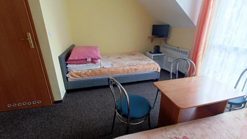 Una cama o camas en una habitación de Delfin -przy plaży, widok na morze