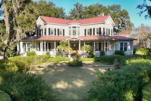a large white house with a red roof at Montage Palmetto Bluff in Bluffton
