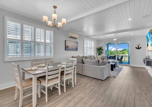 a dining room and living room with a table and a couch at Bayview Pointe in Cortez
