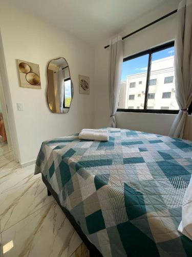 Un pat sau paturi într-o cameră la F - Apartamento Central e moderno